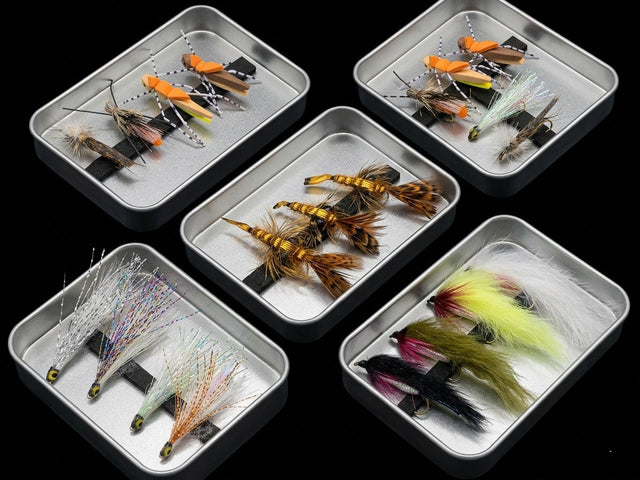 5 sets of handtied flyers in metal containers for fly fishing.