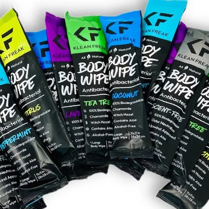 Klean Freak variety pack body wipes featuring all scents including Peppermint, Tea Tree, Citrus, Lavender, Coconut, and Unscented, displayed in colorful individual travel-size packs for camping, gym, travel, and outdoor use.