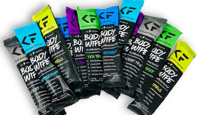 Klean Freak variety pack body wipes featuring all scents including Peppermint, Tea Tree, Citrus, Lavender, Coconut, and Unscented, displayed in colorful individual travel-size packs for camping, gym, travel, and outdoor use.