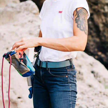 Women wearing Arcade Belt while outdoors on a hike.