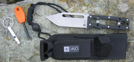 Dajo adventure knife with protective case, paracord wrap, integrated fire striker, and emergency whistle, displayed as a complete outdoor survival tool set.