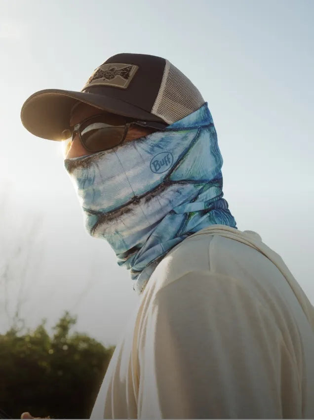 Man wearing Buff neckwear in blue and white with sunglasses and a hat while being protected from the UV sun rays and insects.