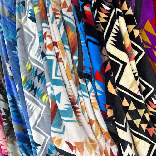 Nativo decorative woven blanket and large absorbent towel with vibrant tribal-inspired patterns for beach, bath, and home use.