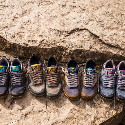 Lems Trail Blazer hiking shoes in a rugged outdoor setting, featuring a minimalist zero-drop design with durable outsole and breathable upper for trail use.