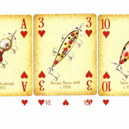 Four vintage-style fishing card illustrations arranged side by side, resembling playing cards with red hearts and numbers. The cards depict different fishing lures: a nightlight breadhead, a brokenback number 30, a silk honey c.