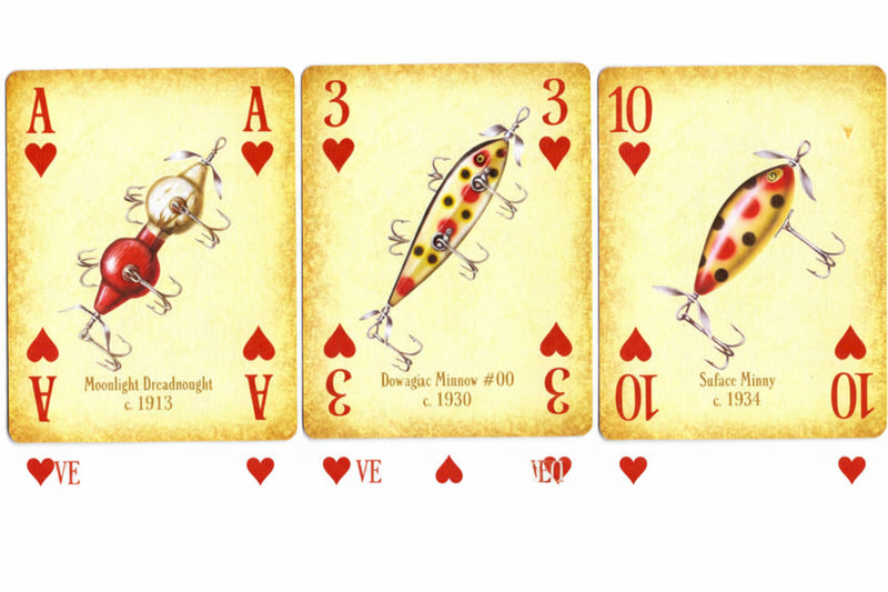 Four vintage-style fishing card illustrations arranged side by side, resembling playing cards with red hearts and numbers. The cards depict different fishing lures: a nightlight breadhead, a brokenback number 30, a silk honey c.