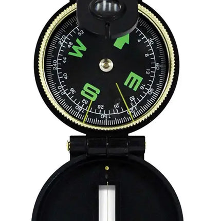 Black and gold compass with a black face and green cardinal directions