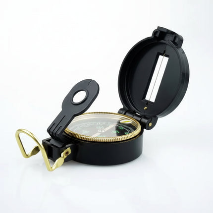 Black and gold compass with an open lid and a clear top