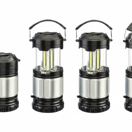 Four black and silver camping lanterns, one collapsed, three extended with LED lights visible