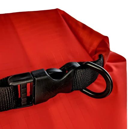 Close up of a black buckle and D-ring on a red dry bag
