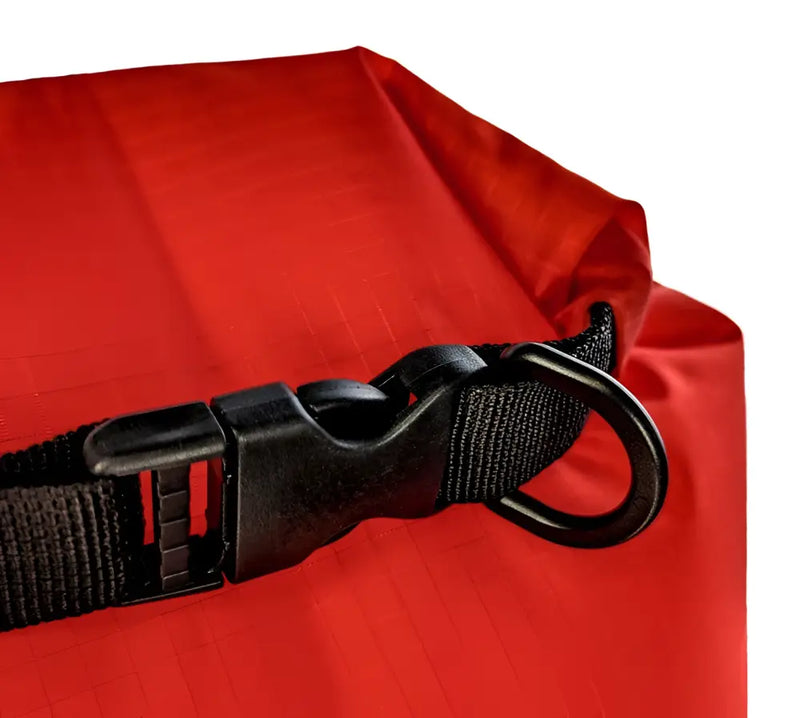 Close up of a black buckle and D-ring on a red dry bag