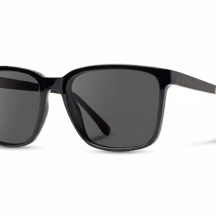 Black sunglasses with dark lenses on a white background