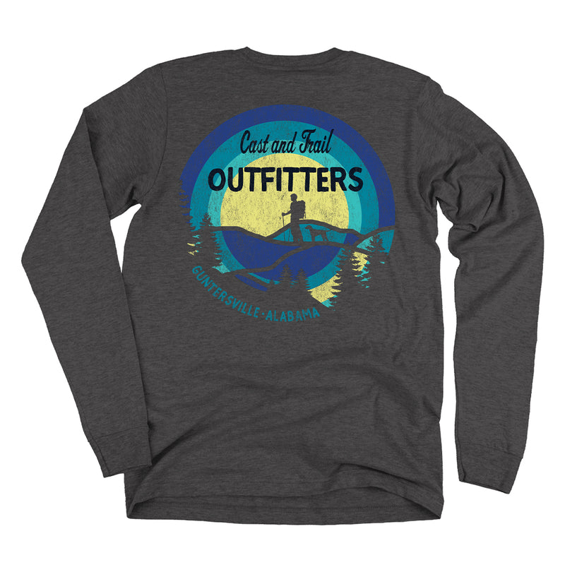 Gray long-sleeve shirt with a graphic design on the back featuring 'Cast and Trail Outfitters' and a silhouette of a person hiking and a dog