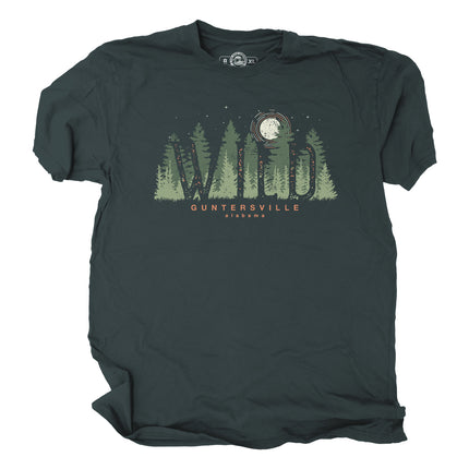 Dark green t-shirt with forest graphic, wild in text, and text stating Guntersville Alabama on a white background