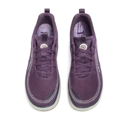 Pair of purple athletic shoes with white stitching and light blue soles