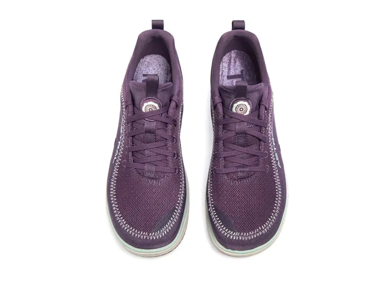 Pair of purple athletic shoes with white stitching and light blue soles