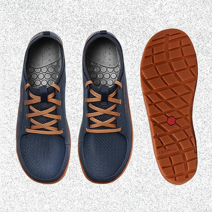 Pair of blue shoes with orange laces and an orange sole