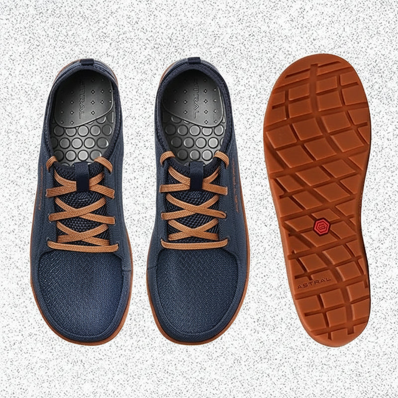 Pair of blue shoes with orange laces and an orange sole
