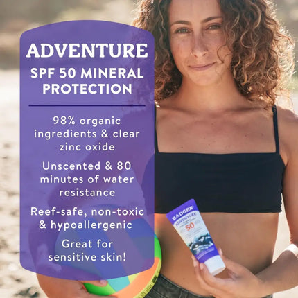 Woman holding Badger Adventure SPF 50 Mineral Protection sunscreen and a beach ball