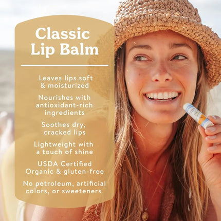 Woman in a straw hat applying lip balm, with text Classic Lip Balm and product benefits