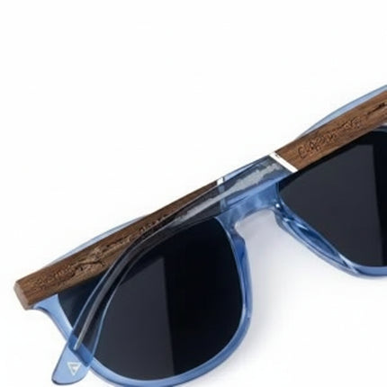 Blue sunglasses with dark lenses and wooden arms