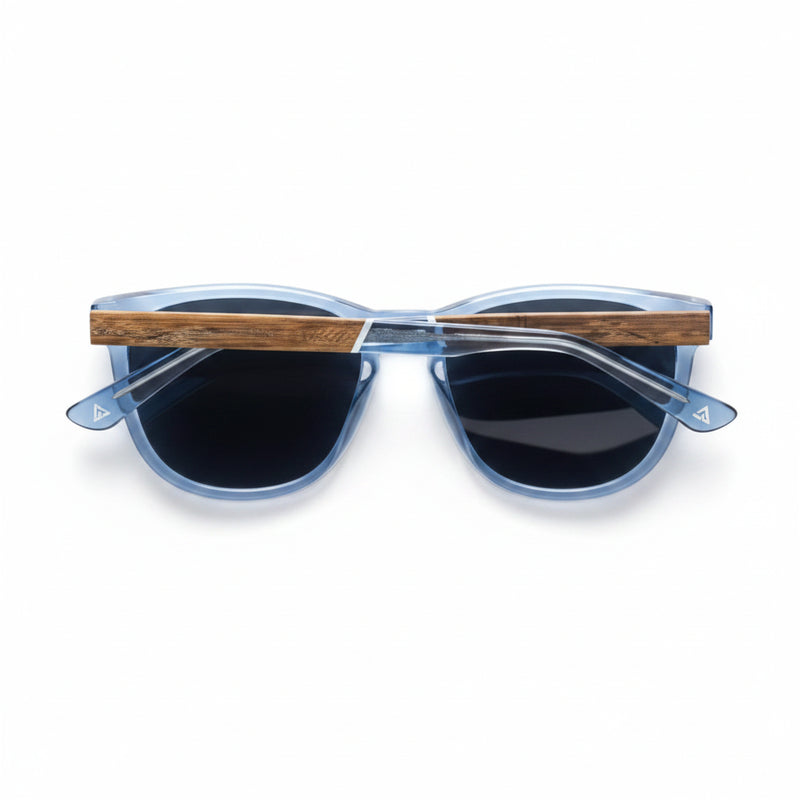 Blue sunglasses with dark lenses and wooden arms