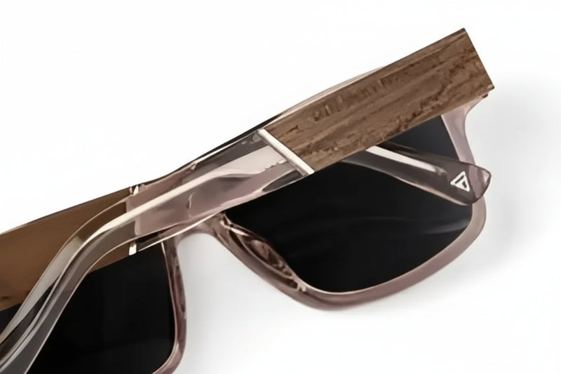 Close up of brown sunglasses with black lenses and a wooden arm