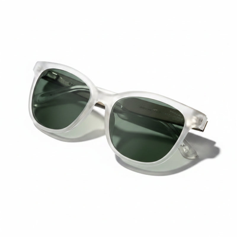 Clear frame sunglasses with dark green lenses