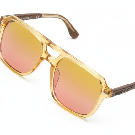 Square frame sunglasses with clear frames and yellow to pink gradient lenses