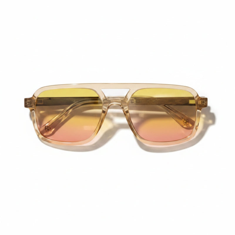 Aviator style sunglasses with clear frames and yellow to pink gradient lenses