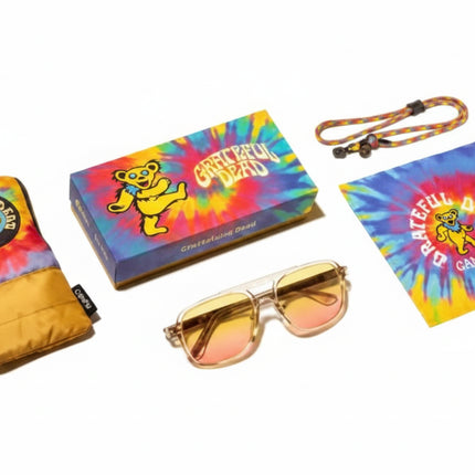 Grateful Dead themed merchandise including a pouch, box, sunglasses, lanyard, and cleaning cloth