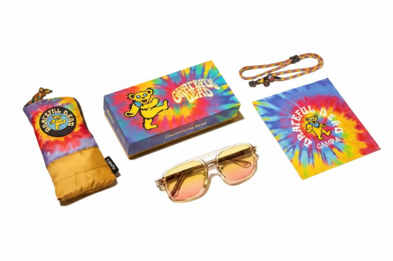Grateful Dead themed merchandise including a pouch, box, sunglasses, lanyard, and cleaning cloth