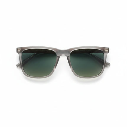Top-down view of sunglasses with clear frames, green lenses, and wood-grain arms