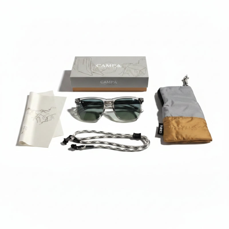 Sunglasses with accessories including a case, strap, cleaning cloth, and box