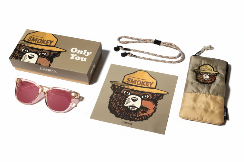 Smokey Bear sunglasses, case, strap, cleaning cloth, and box