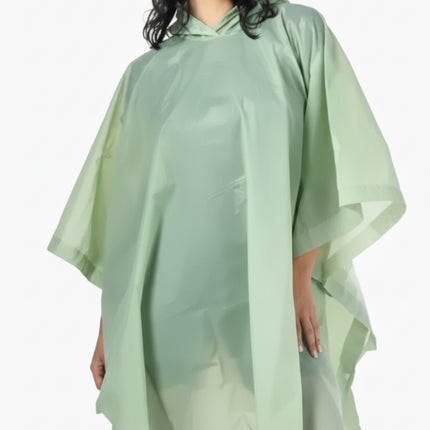 Woman wearing a light green hooded rain poncho