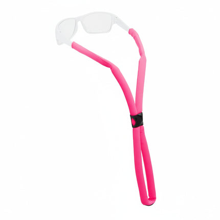 Pink glasses strap holding white frame glasses