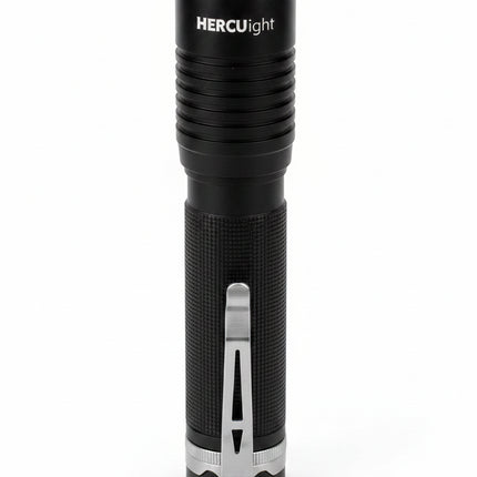 Black flashlight with silver clip and base