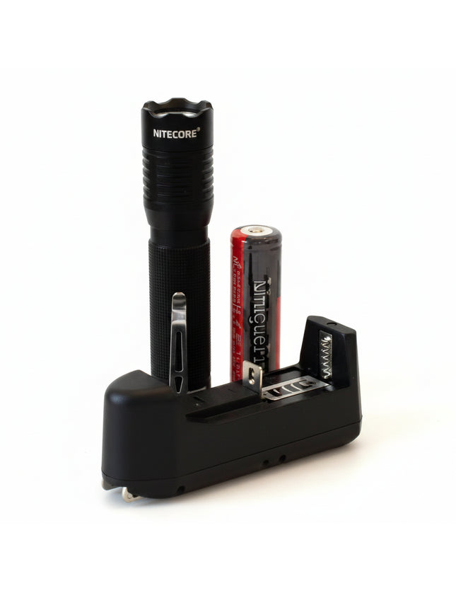 Black flashlight, red battery, and black battery charger