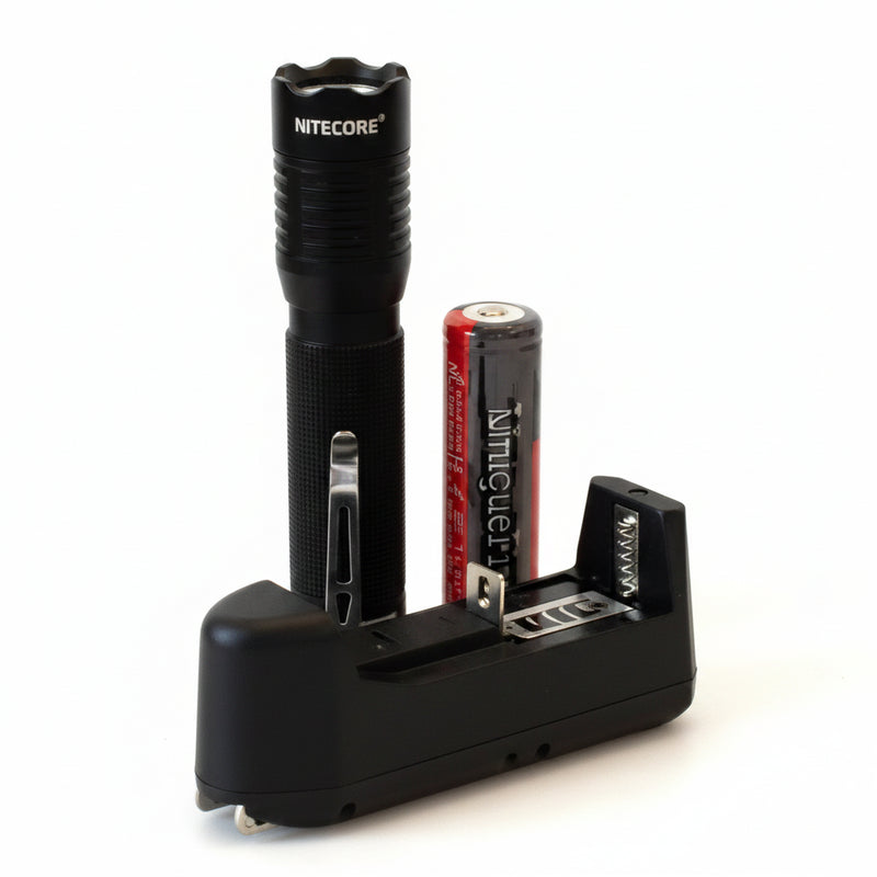 Black flashlight, red battery, and black battery charger