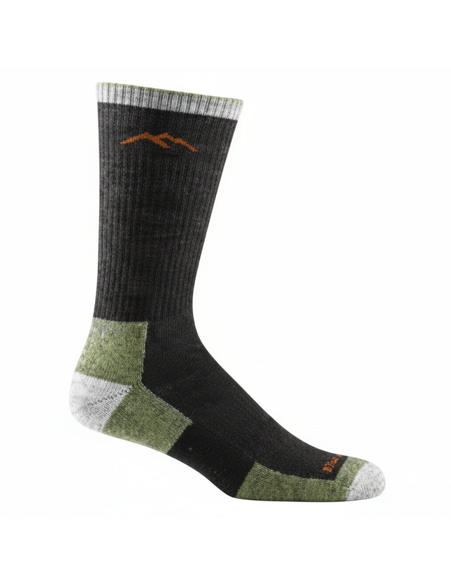 Black sock with green heel and toe, white accents, and a brown mountain logo near the cuff