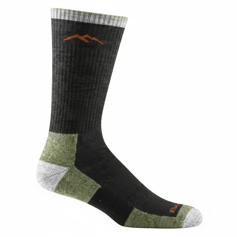Black sock with green heel and toe, white accents, and a brown mountain logo near the cuff