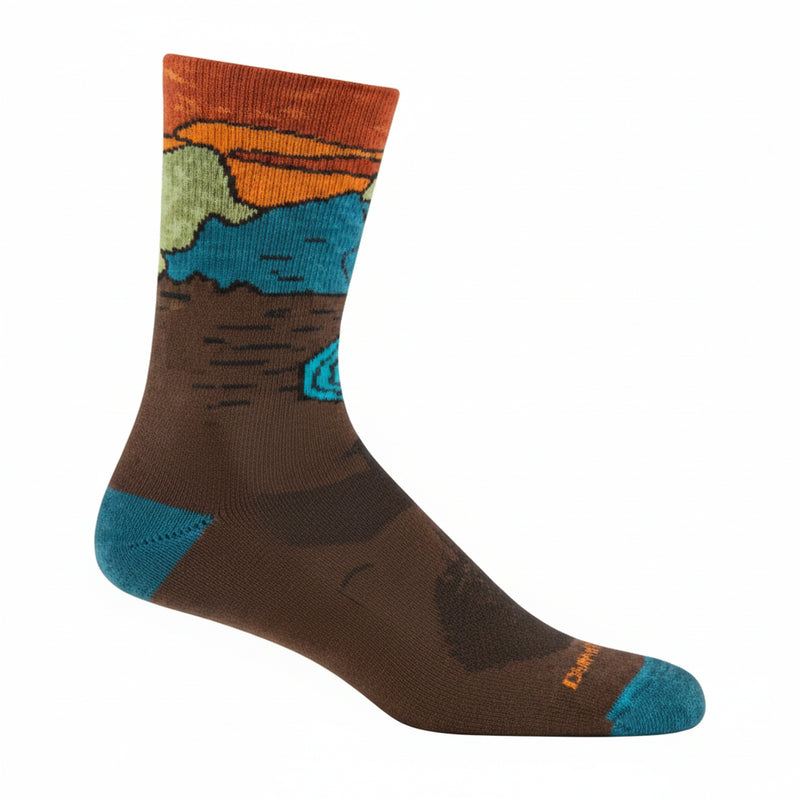 Brown sock with a landscape design featuring mountains, a lake, and a sunset