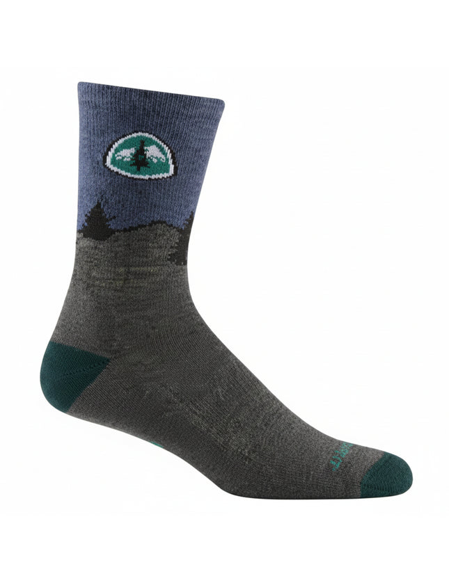 Grey and blue sock with a mountain and tree logo