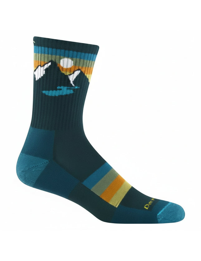 Dark teal sock with mountain and lake graphic, horizontal stripes in blue, orange, and yellow