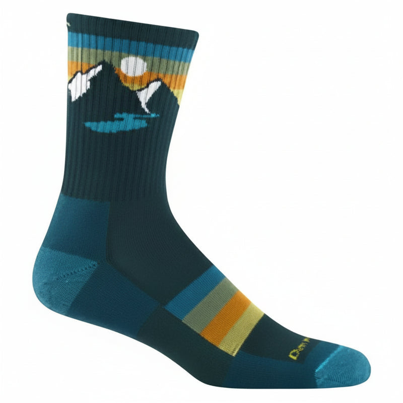 Dark teal sock with mountain and lake graphic, horizontal stripes in blue, orange, and yellow