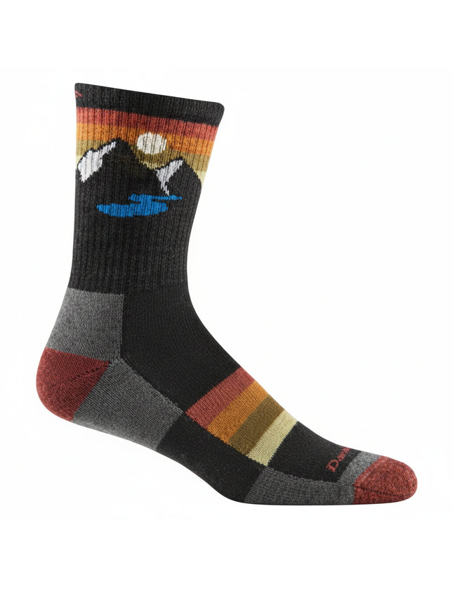 Black sock with mountain and lake design on the cuff, and striped pattern on the foot