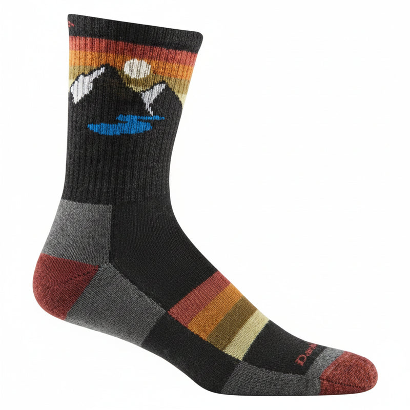 Black sock with mountain and lake design on the cuff, and striped pattern on the foot