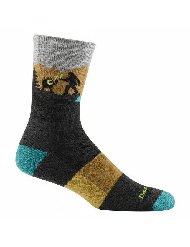 Black sock with a grey cuff, a brown and green landscape, and a silhouette of Bigfoot