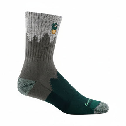 Grey and green sock with a forest and duck design